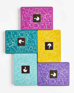 Five colorful card decks with geometric designs on a white background
